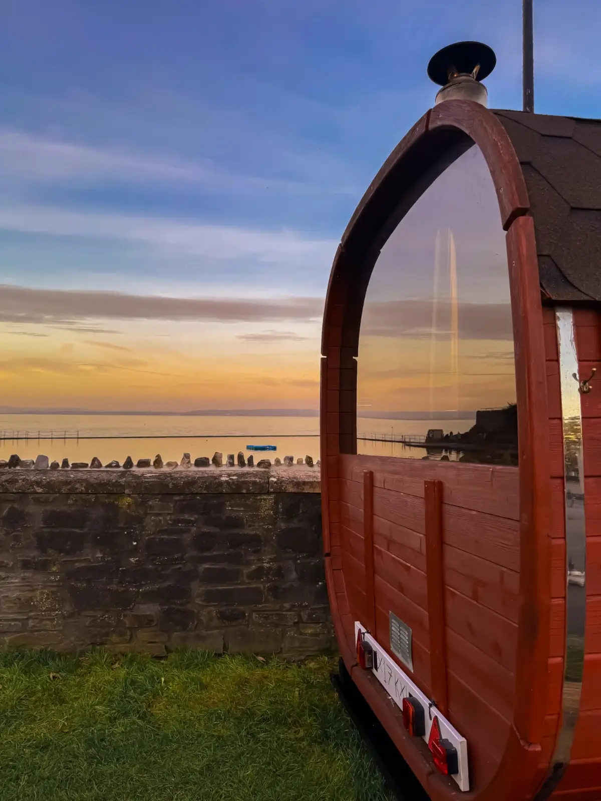 The Suvi Sauna wood-fired barrel sauna beside Clevedon Marine Lake